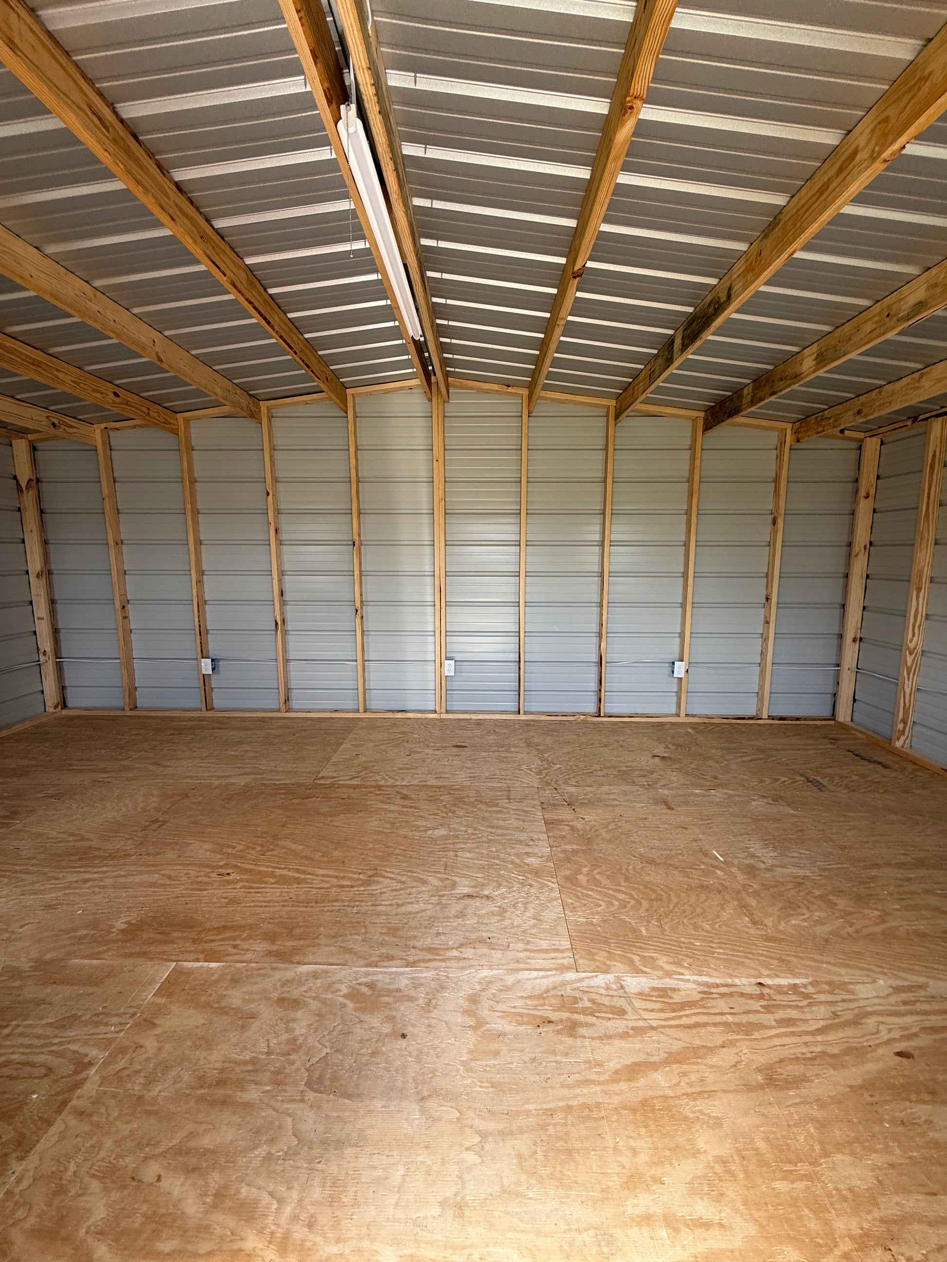 inside 12x20 regular roof portable building with an electrical package