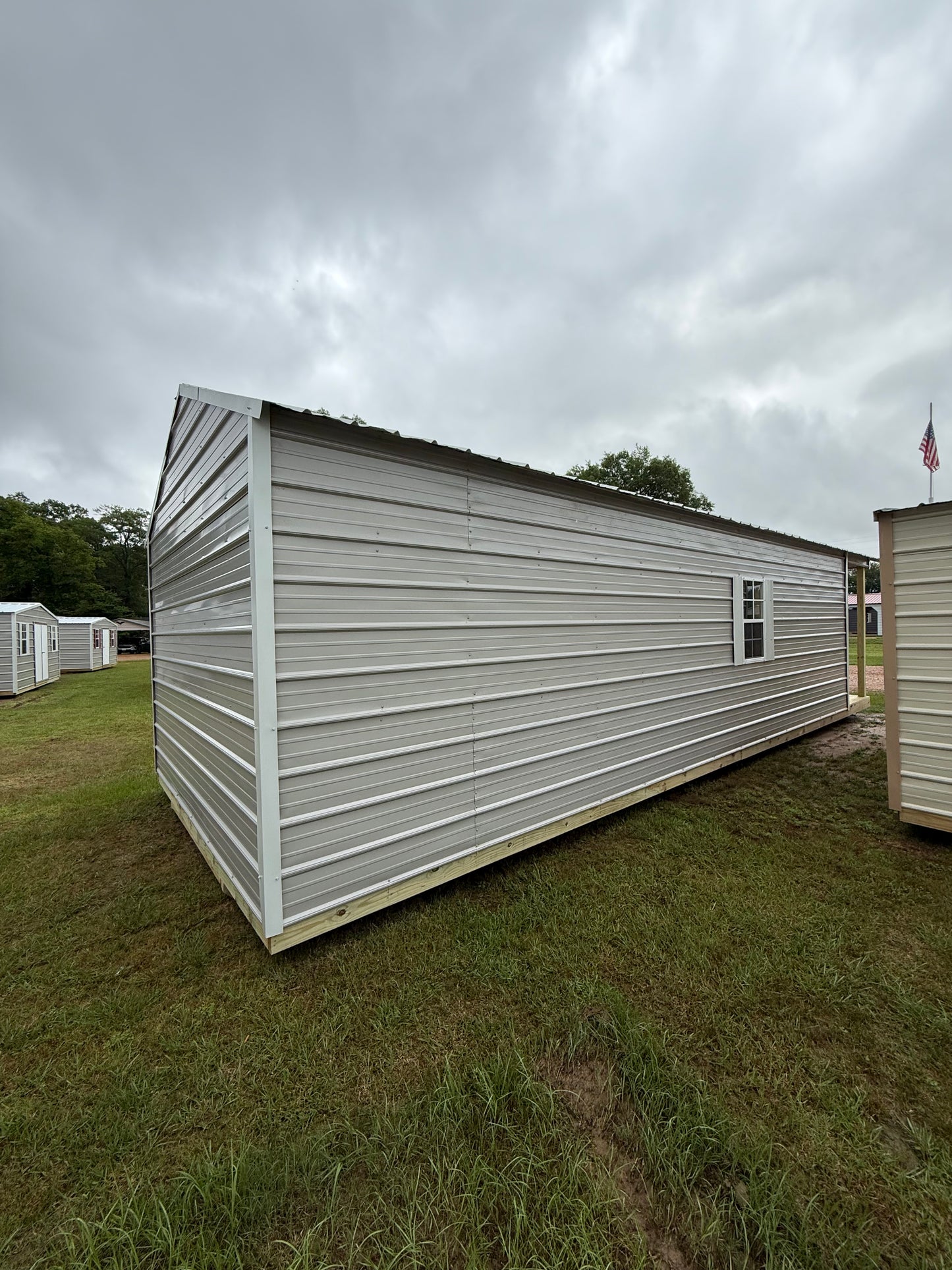 side/back of 12x32 peak cabin gray/alamo white
