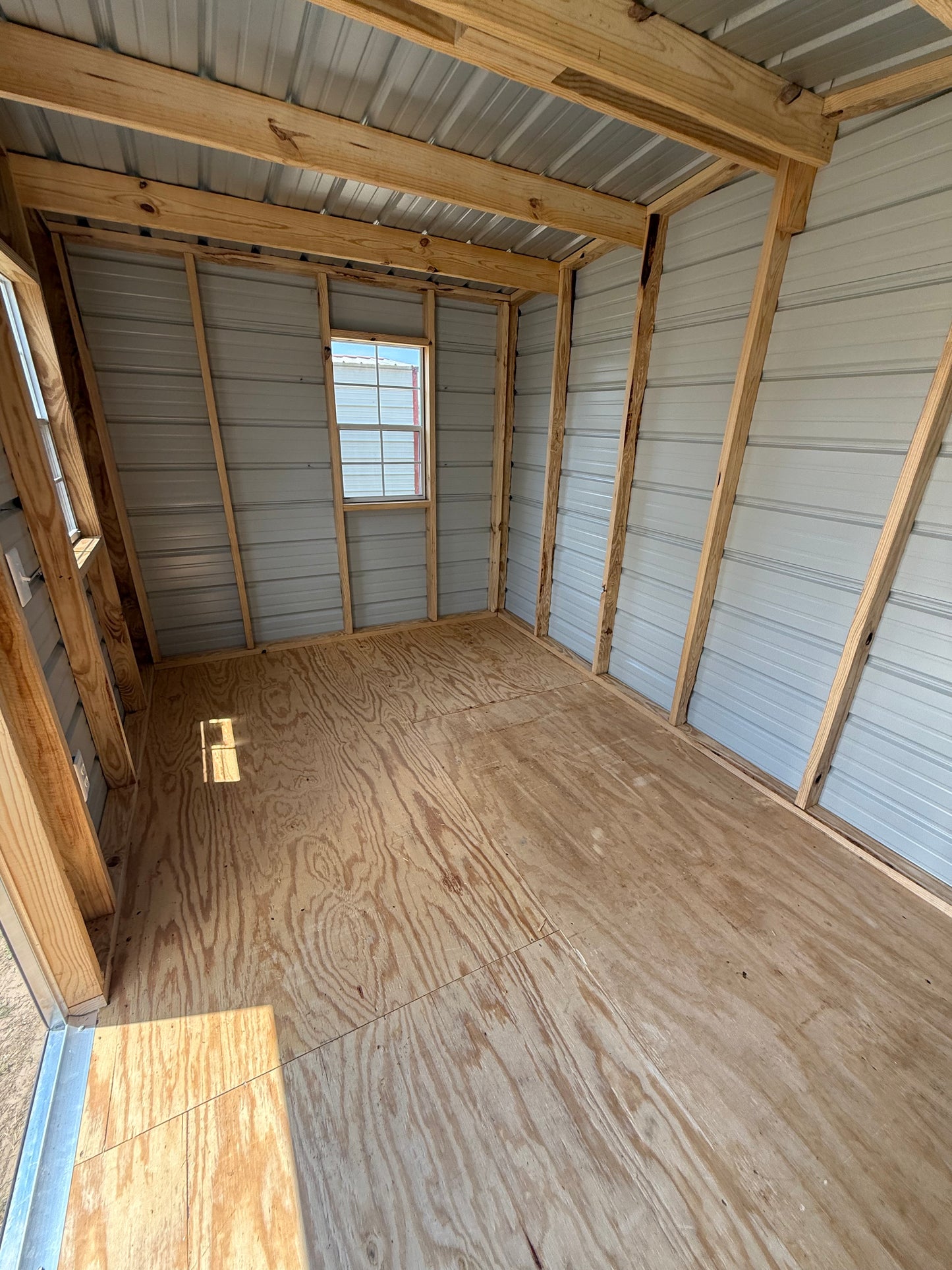inside 8x12 bulding with 2 windows