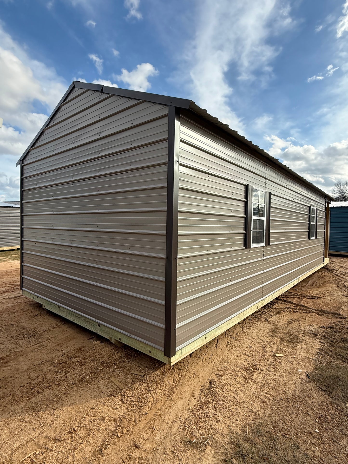 back/side view of 12x32 peak cabin portable building
