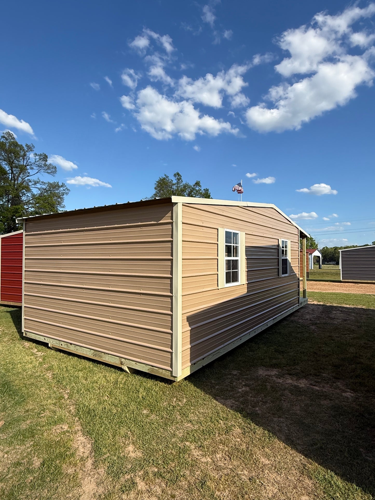 back/side view of 12x24 shotgun cabin tan/light stone 