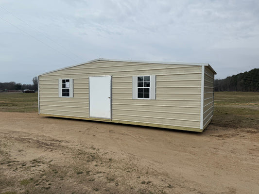  front of a 12x28 light stone/alamo white trim building with a 4' door 