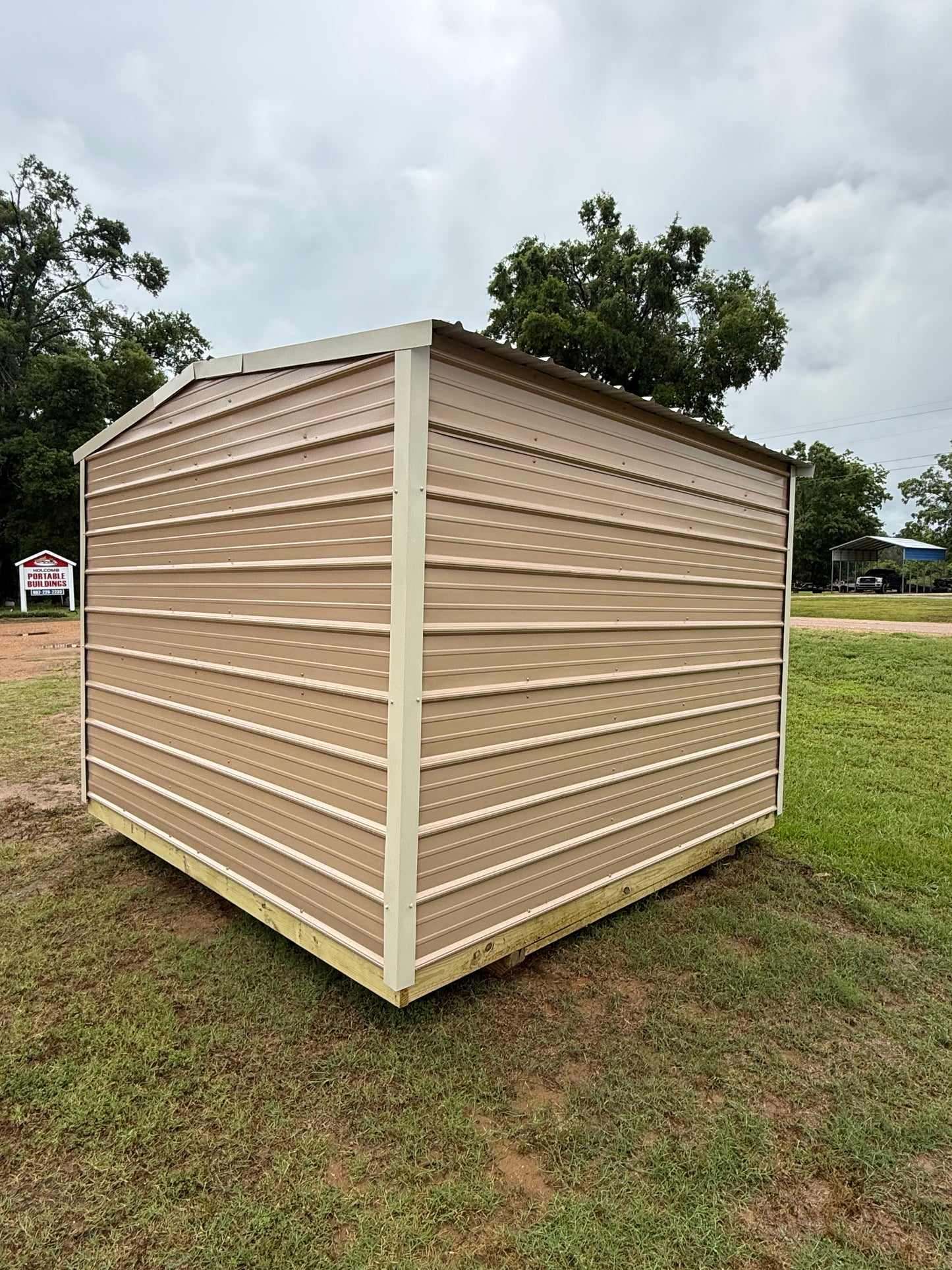 outside view of side/back of 10x10 regular roof portable building 