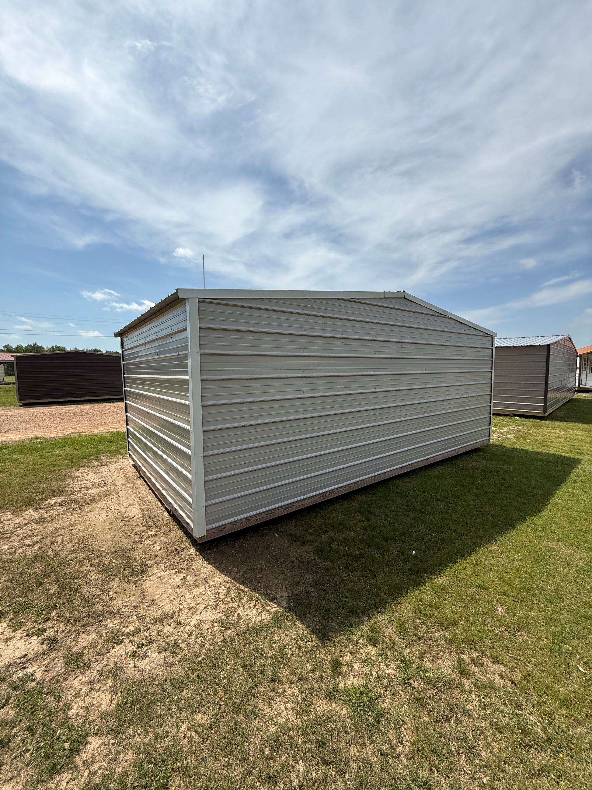 back/side of 12x20 gray/white portable building 