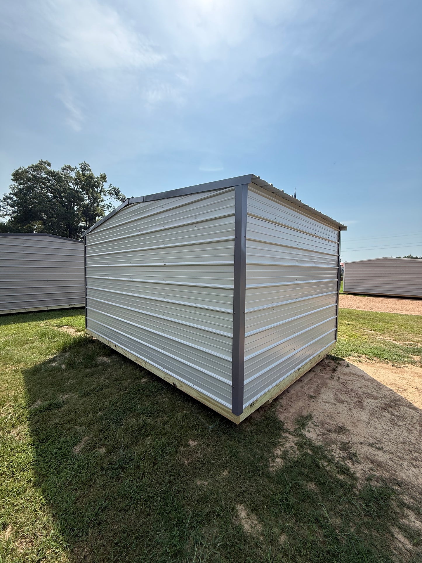 back/side view of 10x14 gray/charcoal regular roof portable building 