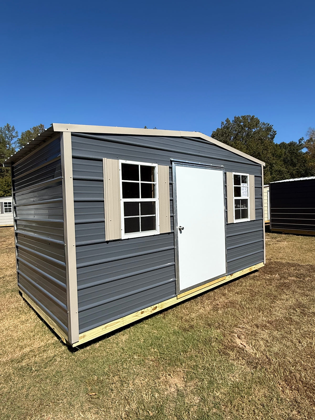 front view of 8x14 smoke/taupe portable building 