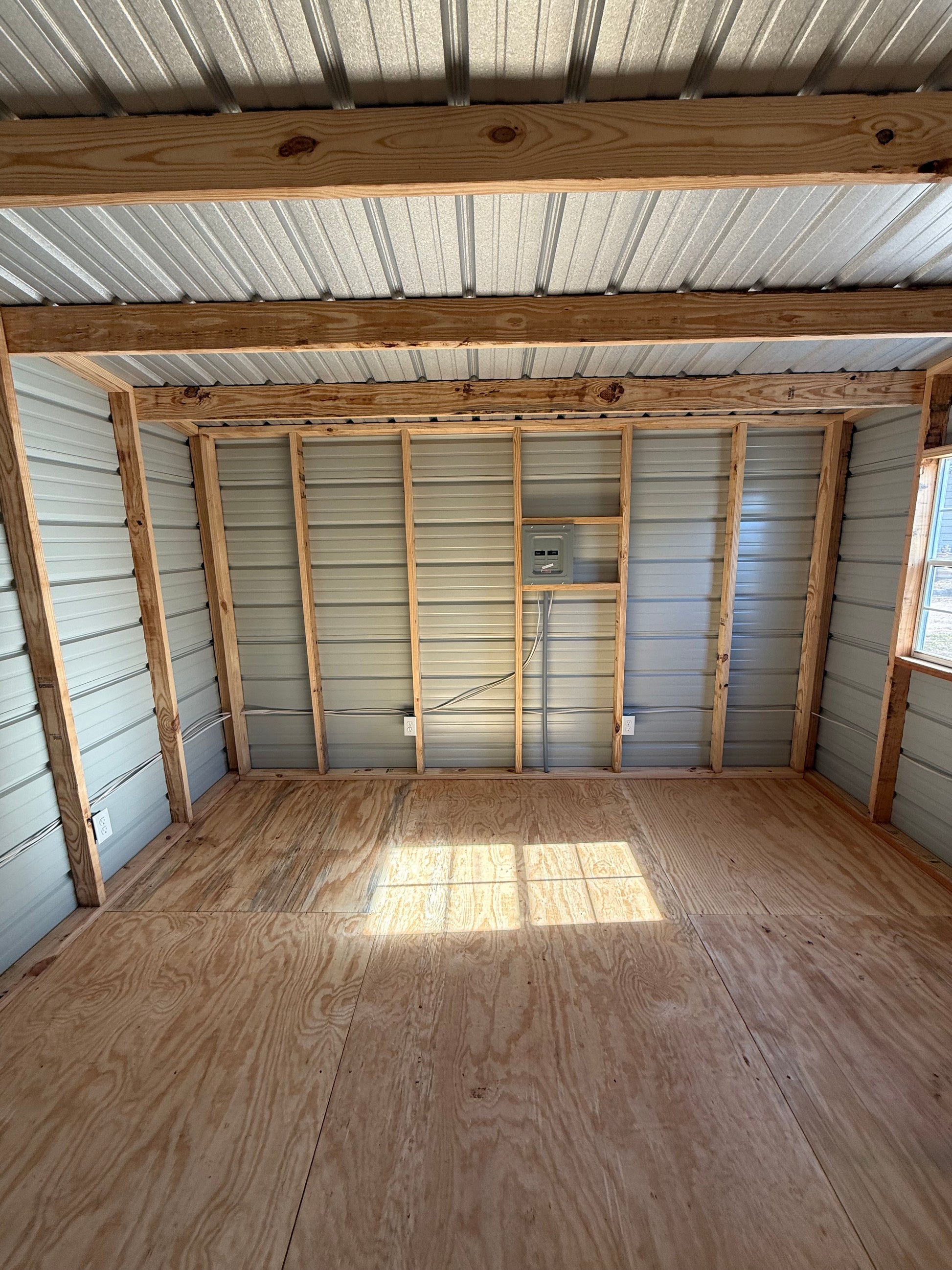 inside view of 12x20 portable building with an electrical package, this side shows breaker box 