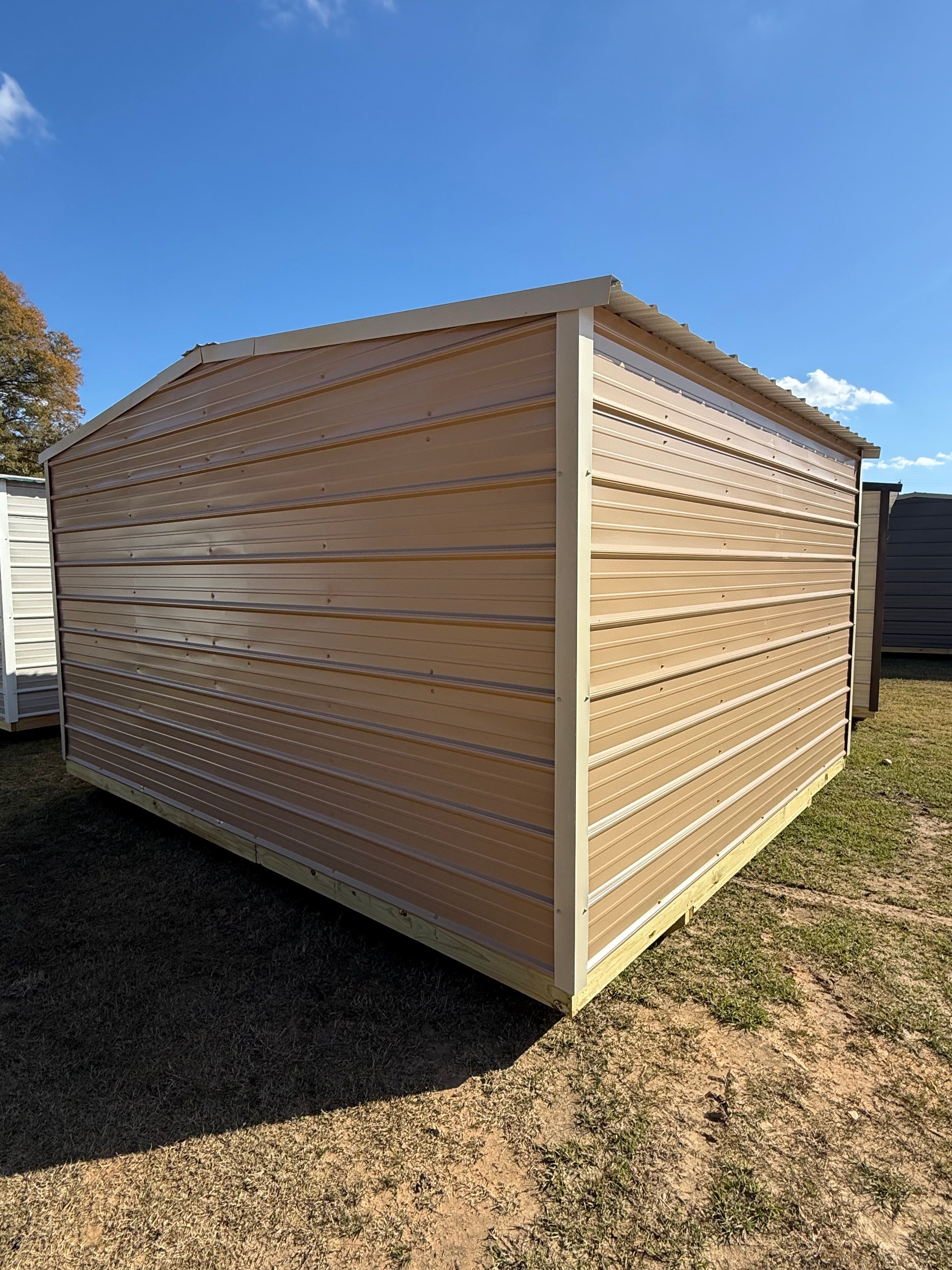 back/side view of 12x14 regular roof portable building, tan/light stone