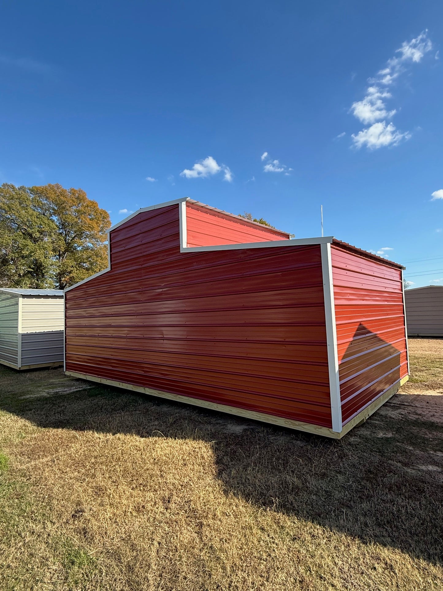 back/side view of 12x24 barn Rustic Red/ Alamo White 
