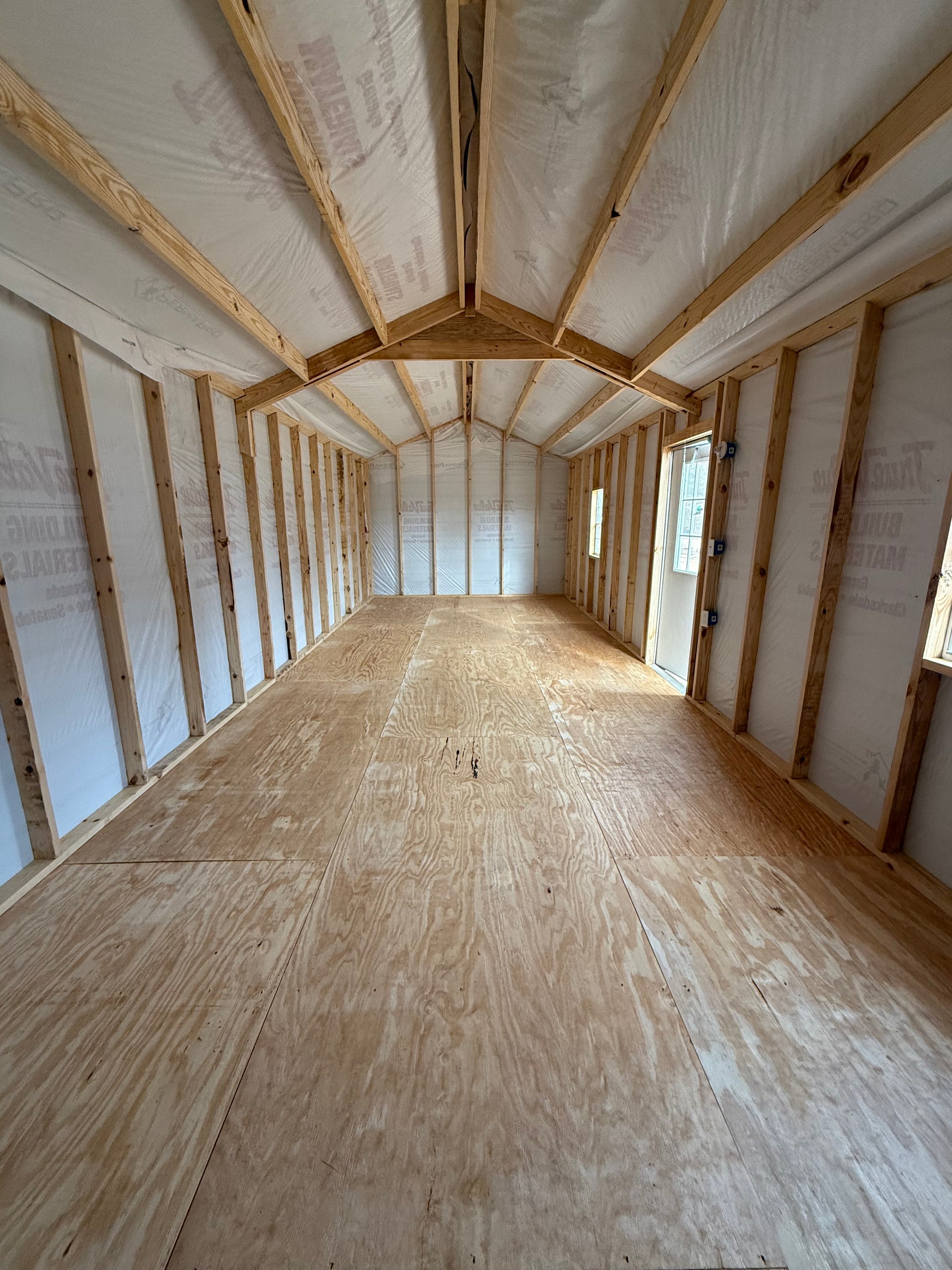 inside 12x32 Peak Portable Building with House Wrap