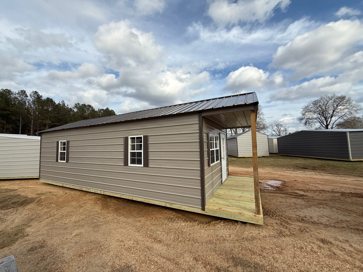 side view of 12x32 peak cabin portable building 