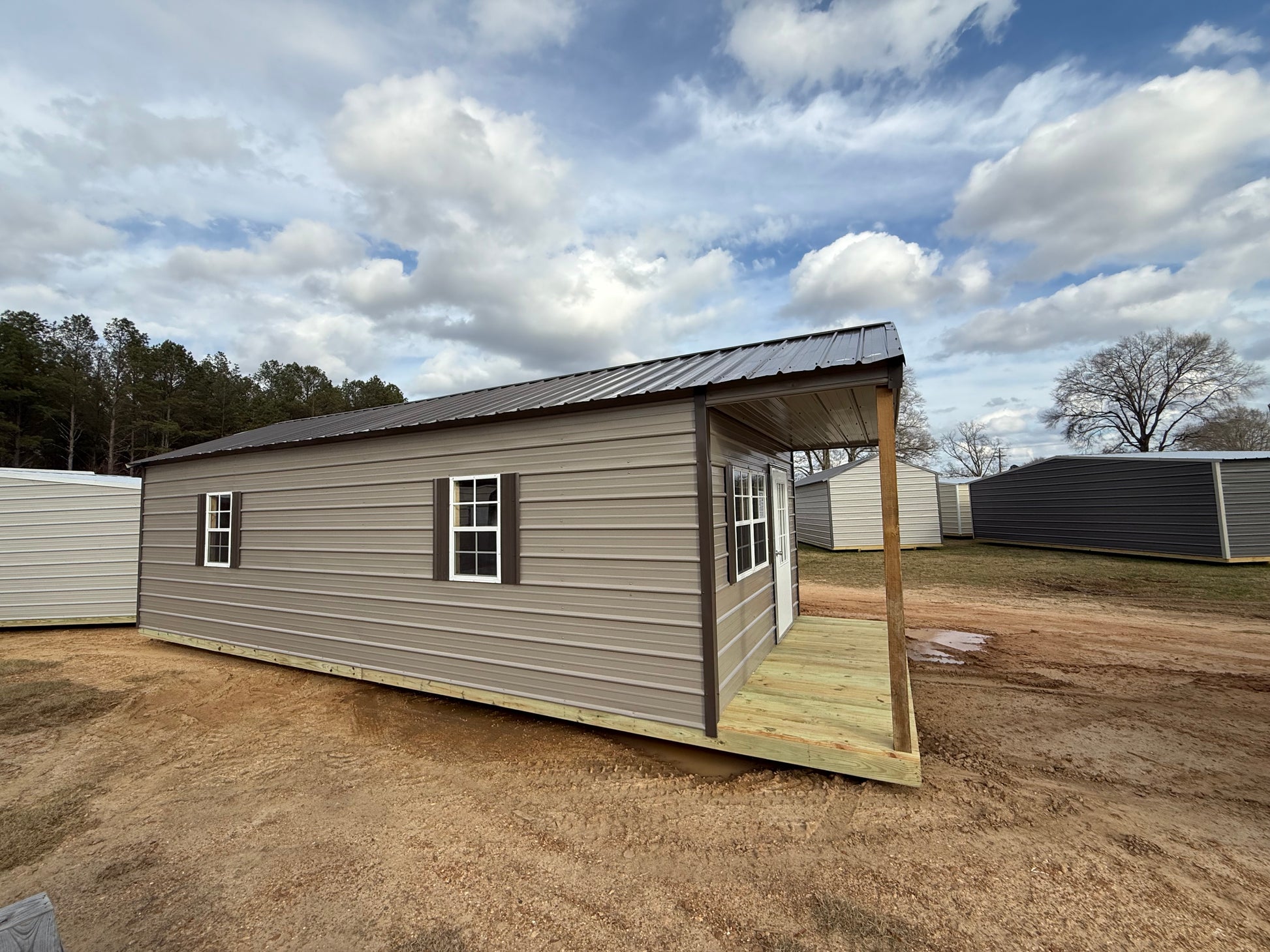 side view of 12x32 peak cabin portable building 