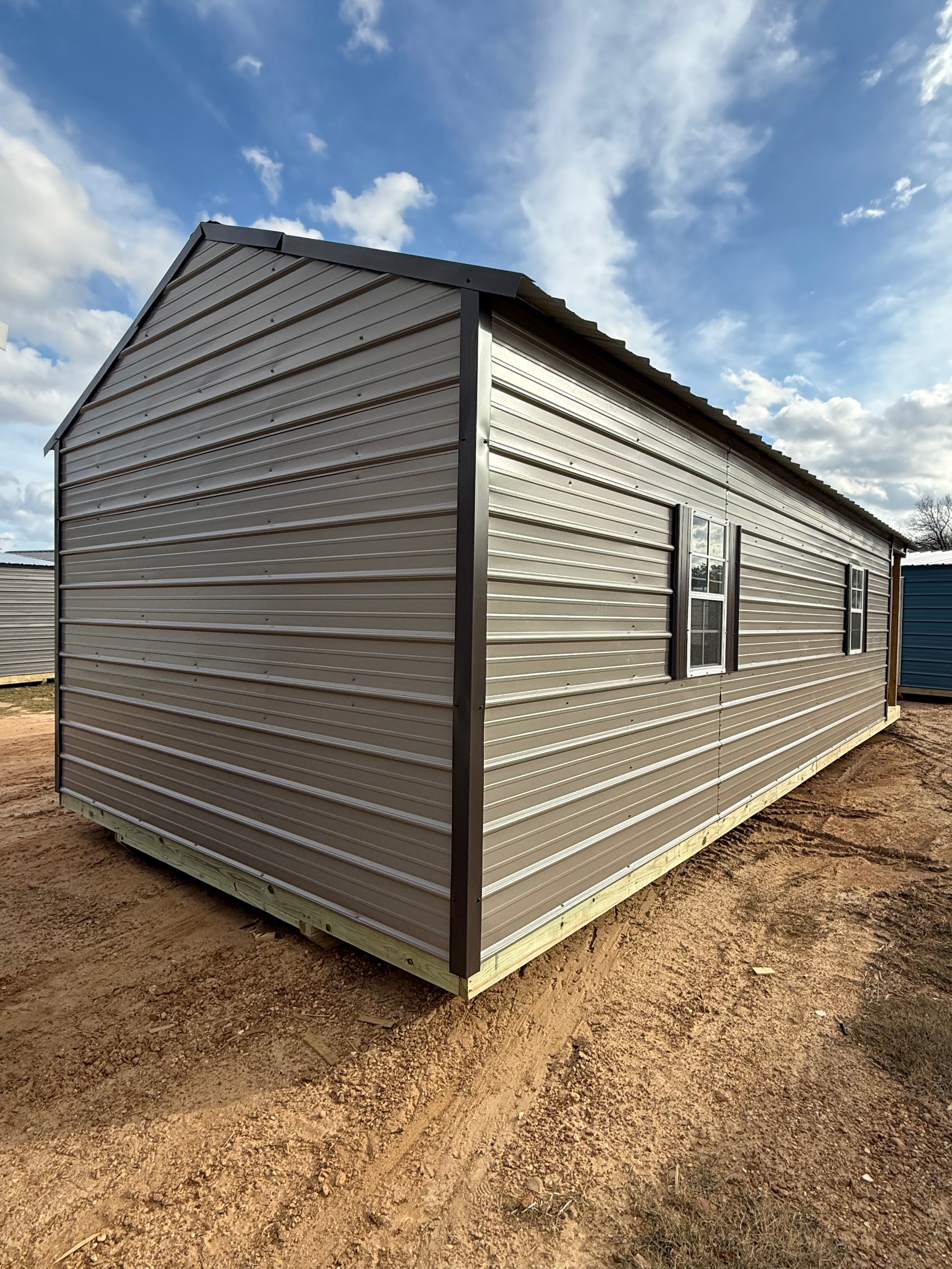 back/side view of 12x32 peak cabin portable building 
