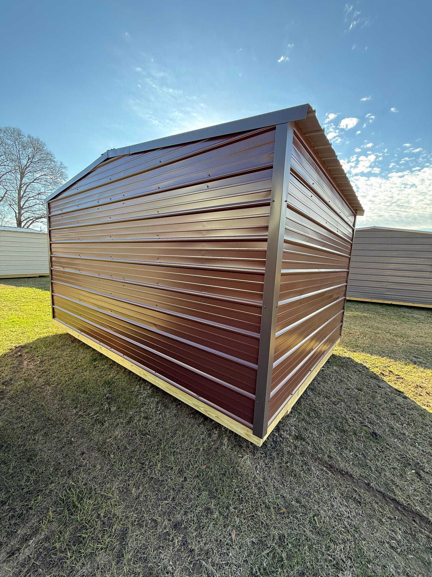side/back view of 10x14 brown/burnished slate regular roof portable building