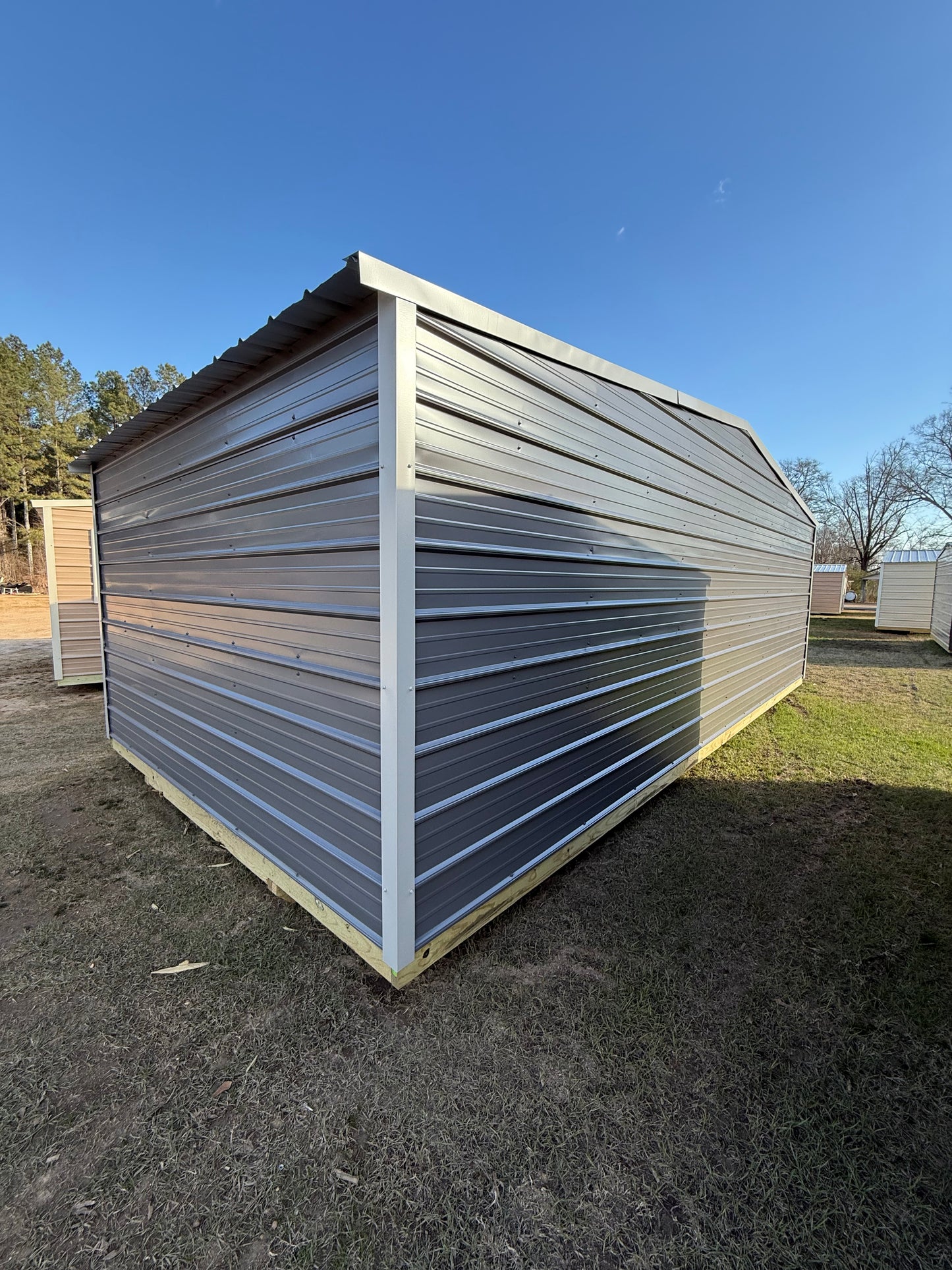 side/back view of 12x24 regular roof portable building 