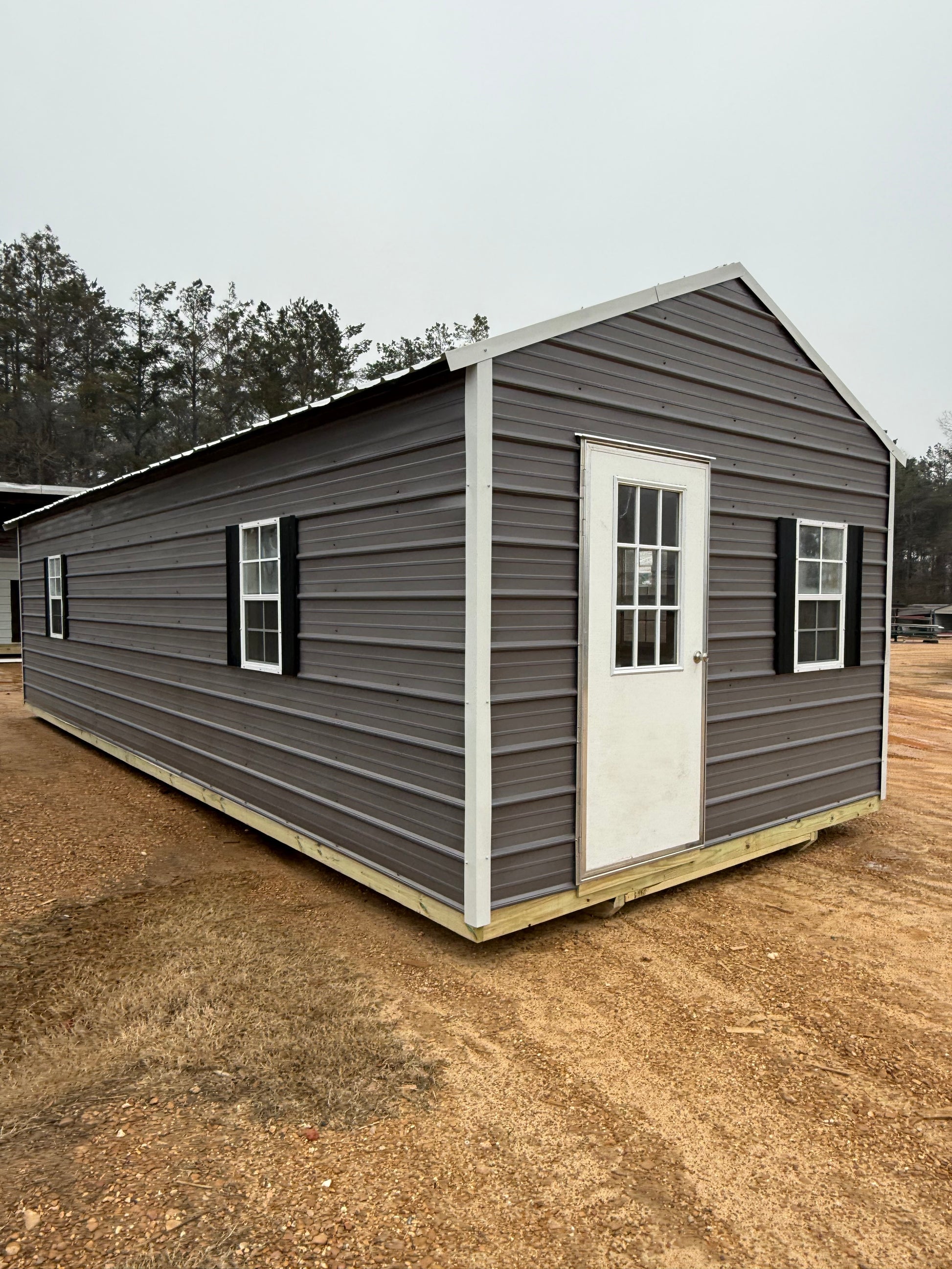 12x32 Peak Building with 9-lite and extra windows, charcoal walls/alamo white roof/trim and black shutters 