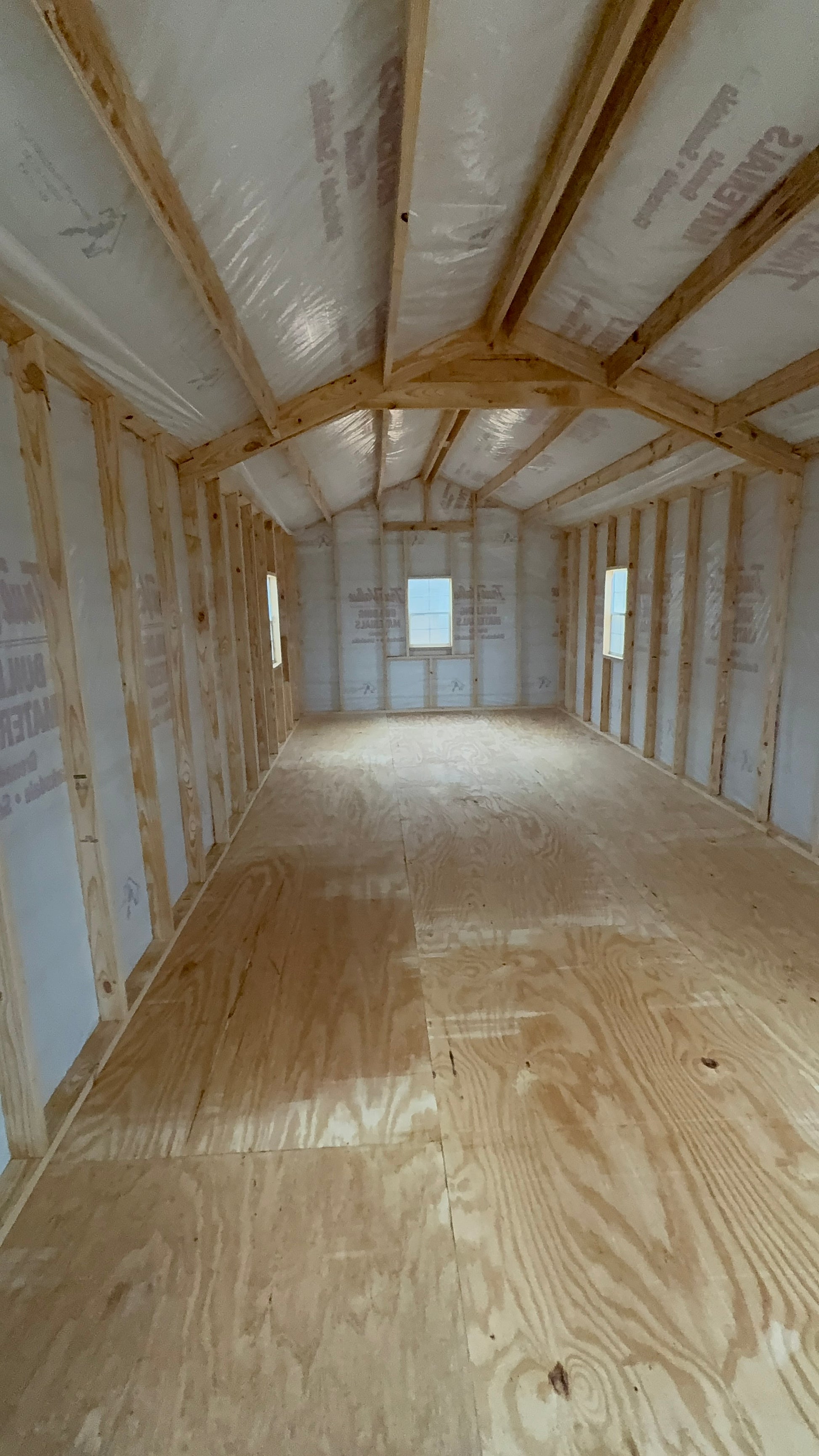 inside view of 12x32 peak portable building featuring house wrap 