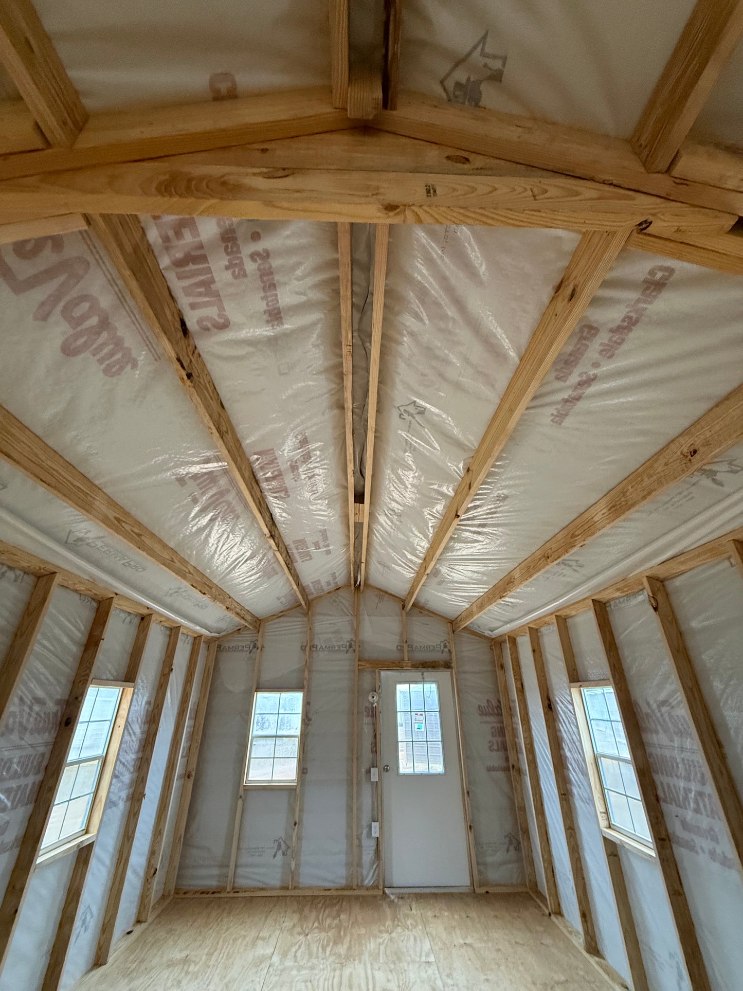 inside view of 12x32 peak portable building featuring house wrap
