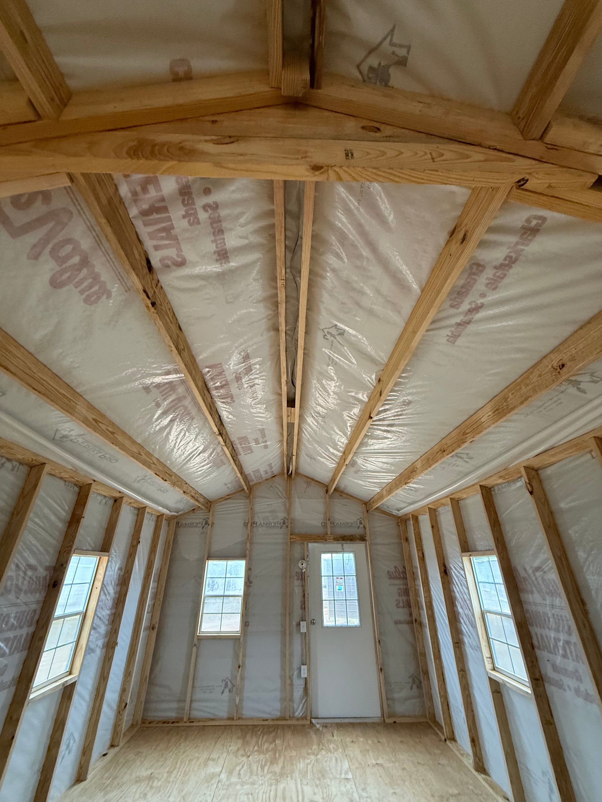 inside view of 12x32 peak portable building featuring house wrap