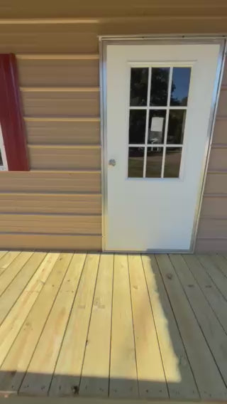video of inside 12x32 peak cabin with house wrap and an electrical package